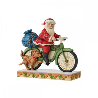 Figura navideña Papá Noel en bicicleta de Enesco